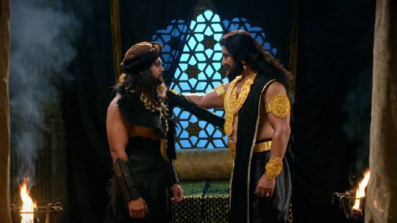 शुक्राचार्य आपल्यापासून काही गोष्टी लपवता आहेत याचा संशय आलेला महिषासुर त्याचा विश्वासू सेनानी आणि मित्र ताम्रासुराला यमुनांचल प्रदेशात तुळजाच्या शोधासाठी पाठवतो.  